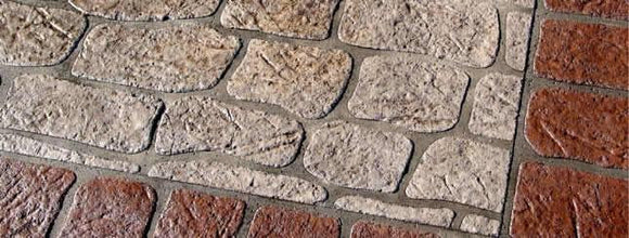Tan Antique Colonial concrete overlay with irregular textured stone shapes, gray joints, and a reddish-brown brick border.