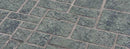 Gray Ashlar Tile concrete overlay with textured square and rectangular tile shapes of varying sizes separated by light brown joints.