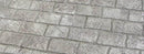 Gray Cobble Brick concrete overlay with textured rectangular brick shapes in staggered rows and darker joint lines