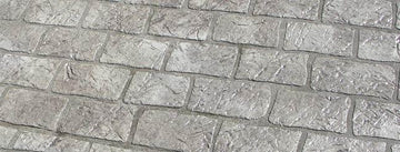 Gray Cobble Brick concrete overlay with textured rectangular brick shapes in staggered rows and darker joint lines