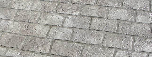 Gray Cobble Brick concrete overlay with textured rectangular brick shapes in staggered rows and darker joint lines