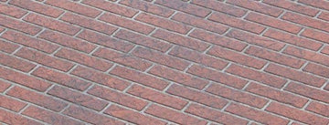 Red facebrick-pattern concrete overlay with staggered rectangular bricks and light gray joint lines