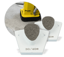 Two white WerkMaster heavy duty metal bond tools with single teardrop segments, marked 30/40 grit, with an inset showing a floor machine on concrete