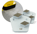 Two white WerkMaster Shark metal bond tools with two grinding segments each, marked 16 grit, with an inset showing a floor machine on concrete